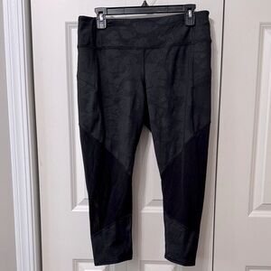 Athleta Cold Weather Black Leggings with Zipper Pockets and a Drawstring Waist.